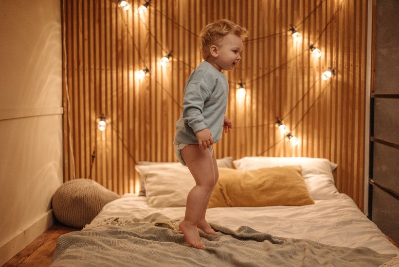 Child jumping on the bed