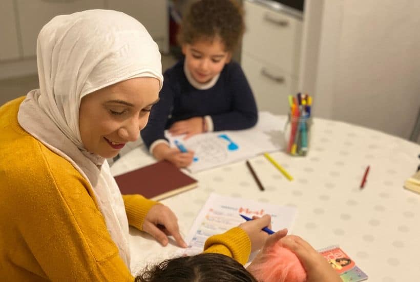 Mother laughing to her daughter in the family meeting