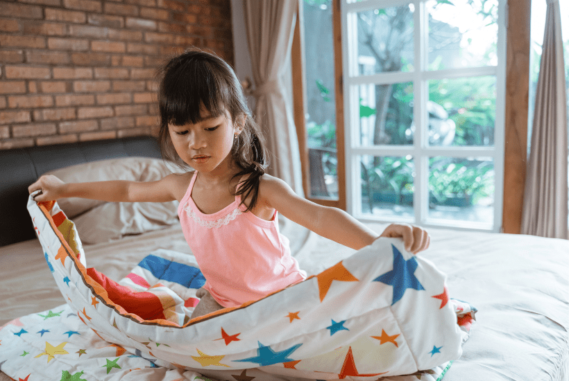 7 year old doing her bed