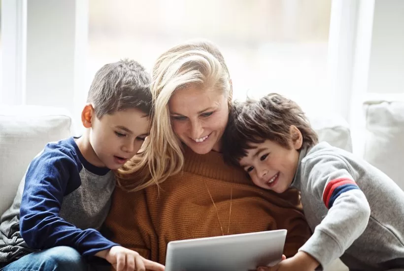 Family having a conversation about balancing screen time together.